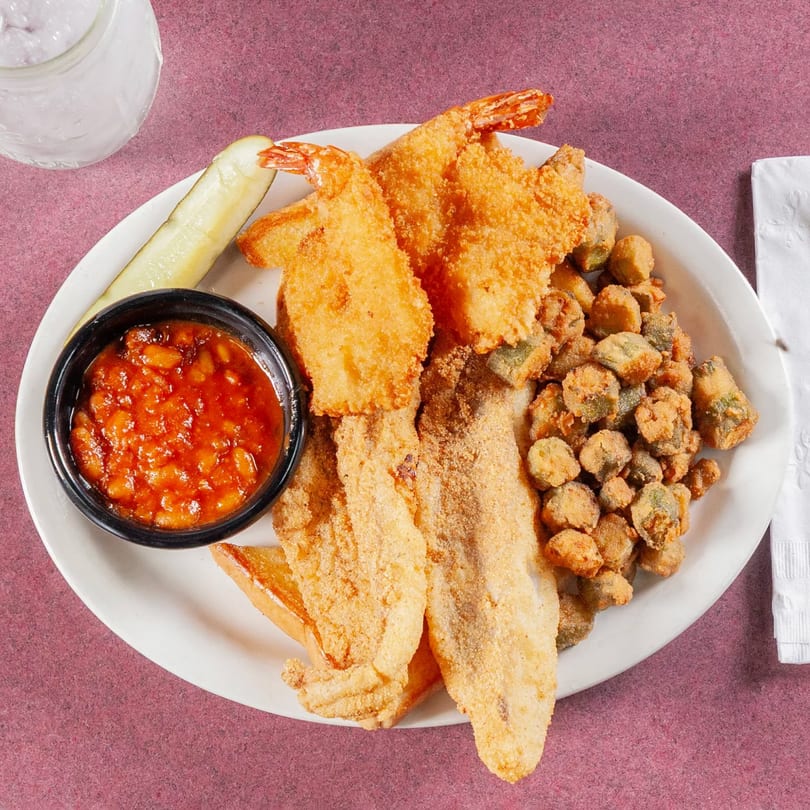 Jerry Neel's fried catfish and shrimp platter with baked beans, fried okra, and a pickle spear.